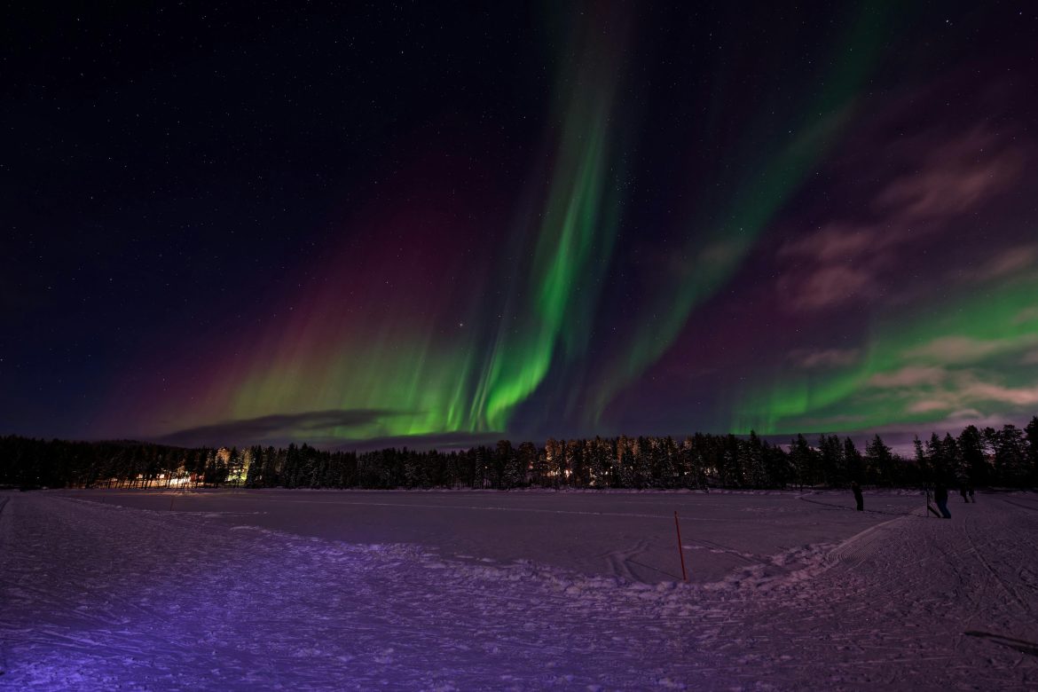 Aurora over snowy landscape