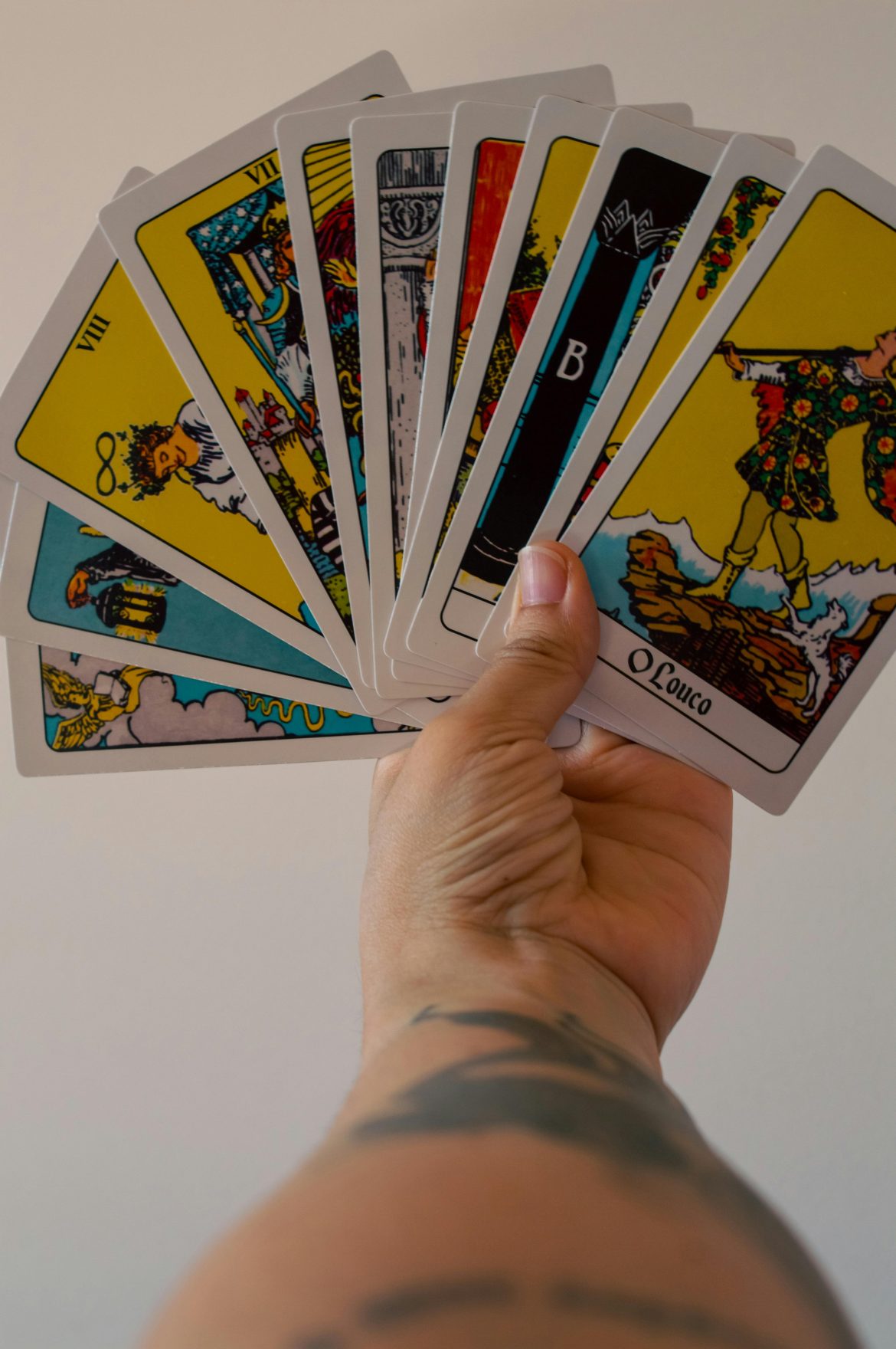 Hand holding tarot cards